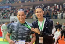 الزميل أحمد سيد ونجله حمزة بعد التتويج